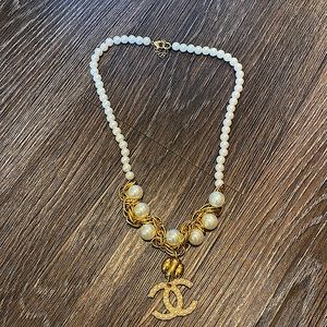 Copy of Chanel Pearl and gold tone necklace. Great for travel.